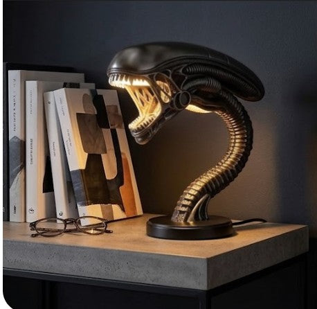 Rinef Alien desk lamp with biomechanical design and LED lighting, perfect for unique home decor.
