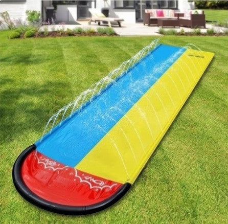 Rinef Summer Splash inflatable slip and slide for kids, blue and yellow PVC with red landing pad, water spraying.