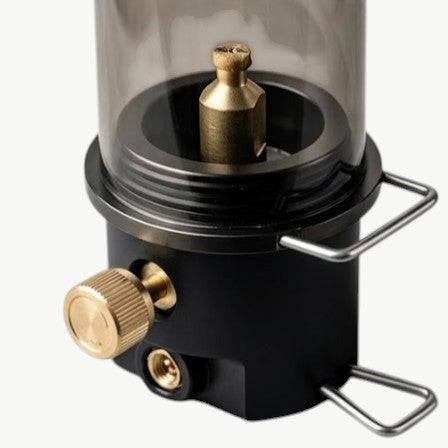 Rinef portable gas lantern with adjustable brightness knob, brass burner, and dark glass shade. Lightweight metal construction.